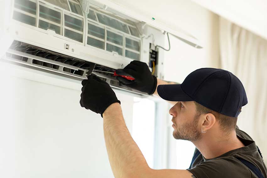 Residential Air Conditioning Repair Expert fixing mini-split system